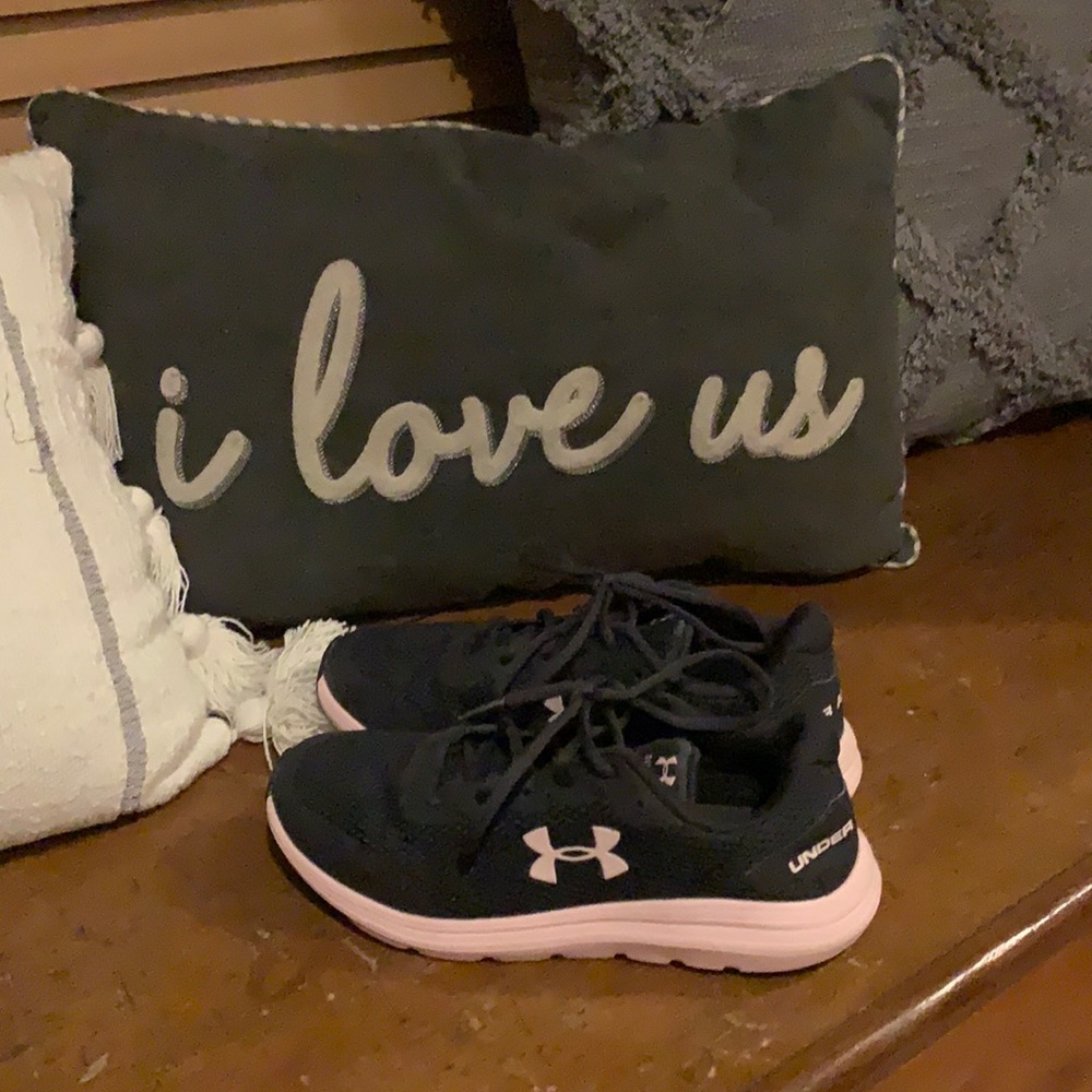 Pink and dark blue under armor shoes